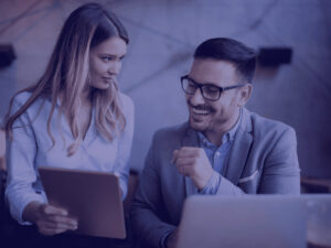 a man and woman looking at a tablet 4 Thresholds of Accounting services for UK Accounting firms